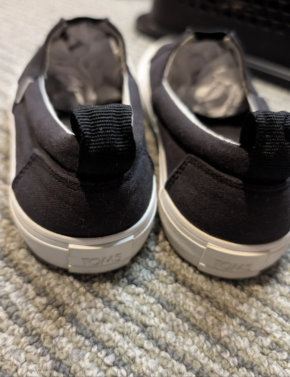 TOMS kids Black Canvas Slip-On Loafers with White Sole